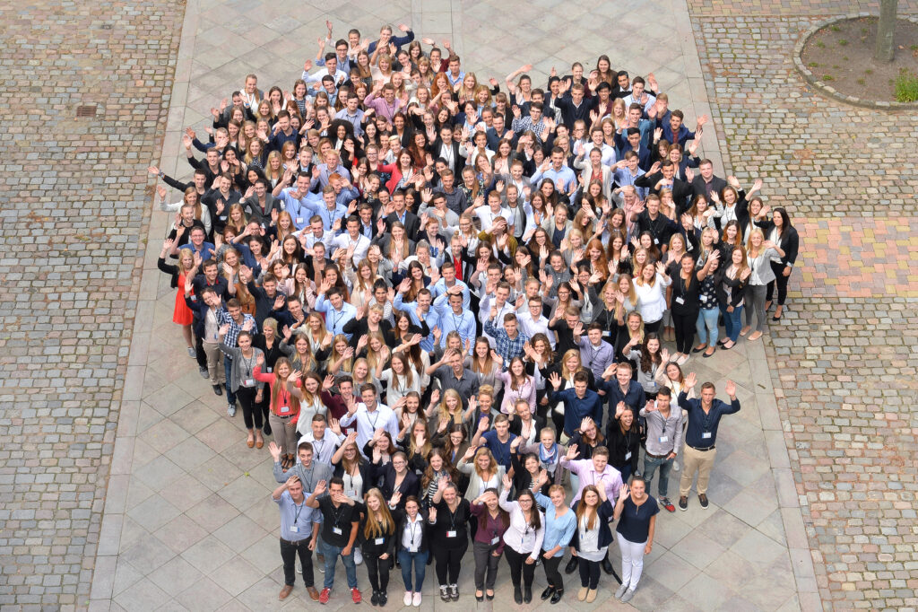 large group of happy employees outside