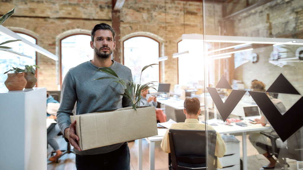 guy in the office holding his stuff in a box