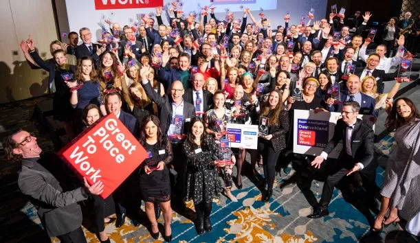 large group of people celebrating the best employers of 2021