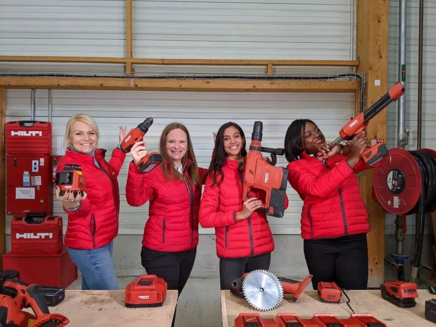 group of pretty women in red jackets laughing