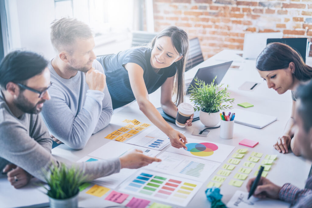 young creative employees strategizing at a table