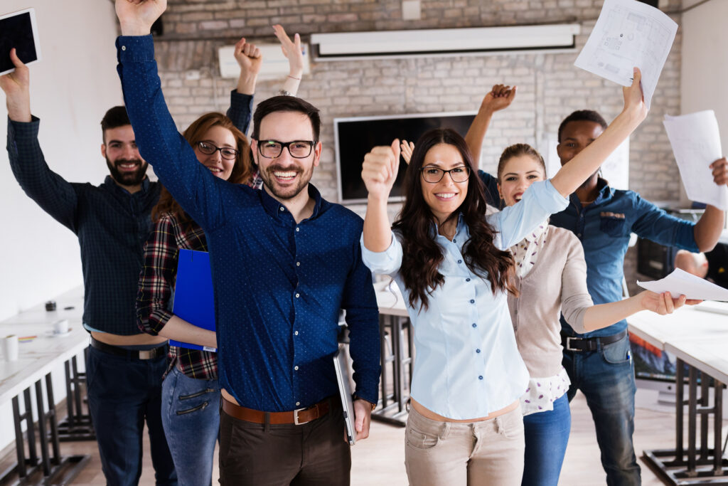 happy employees celebrating in the office