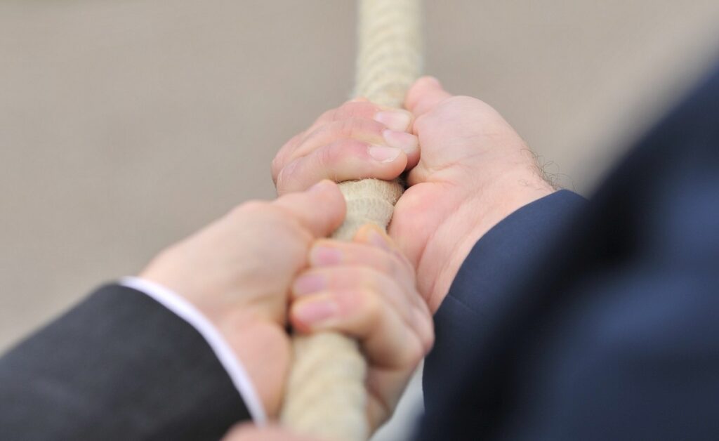 tow rope being pulled by two hands